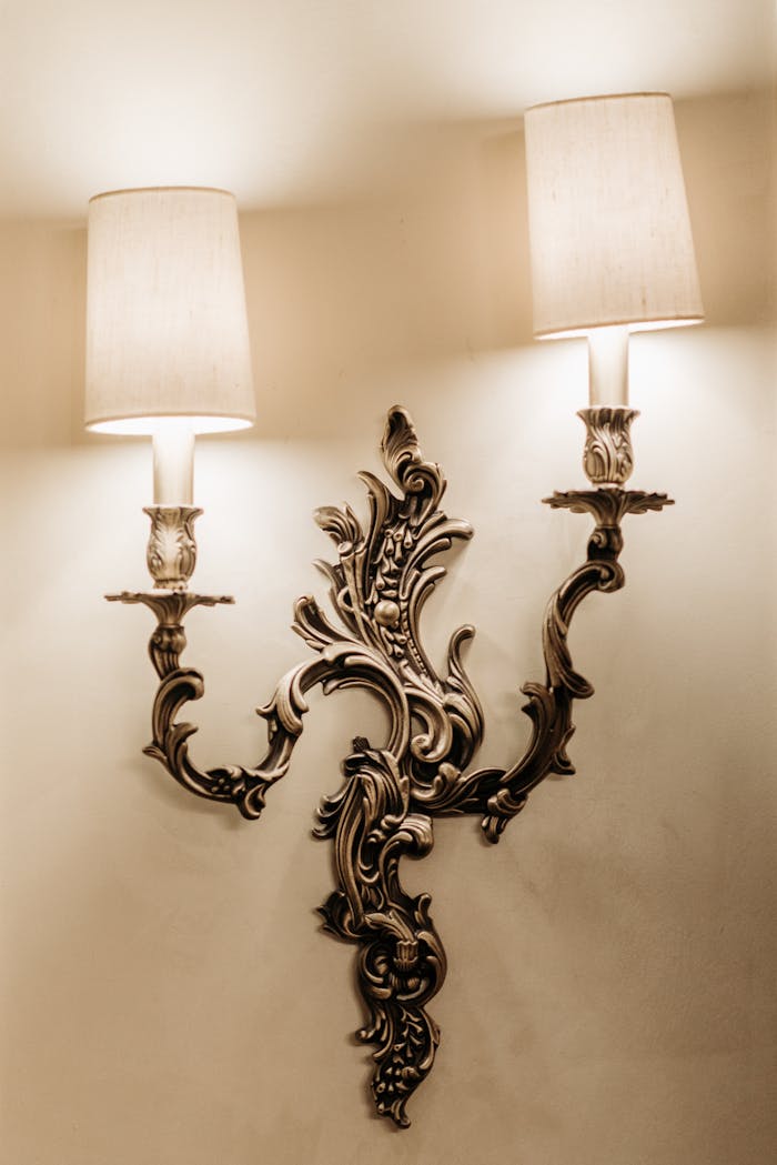 Ornate Victorian sconce lighting with intricate baroque designs, exuding elegance and vintage charm.